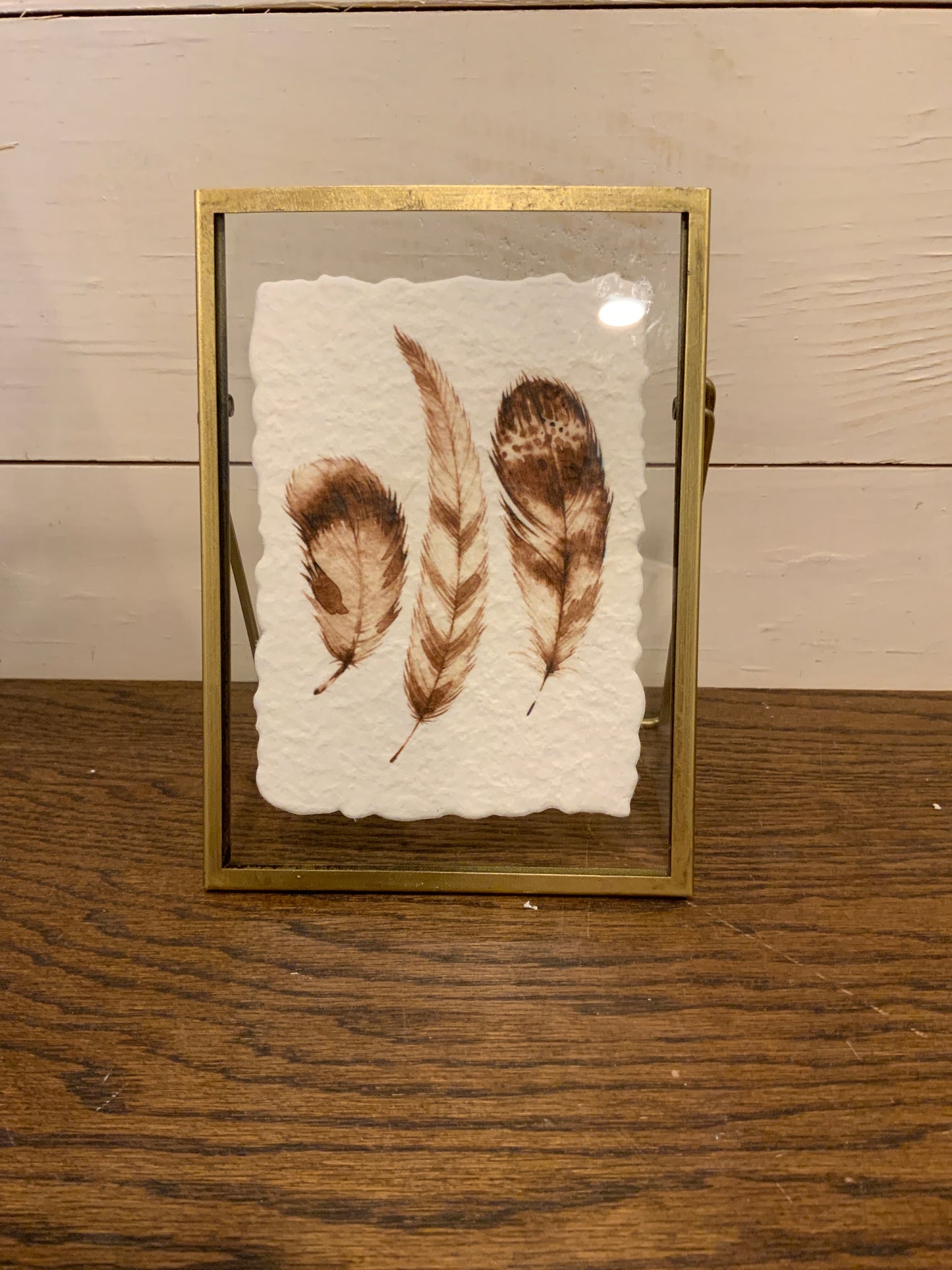 Gold frame w/ feather print