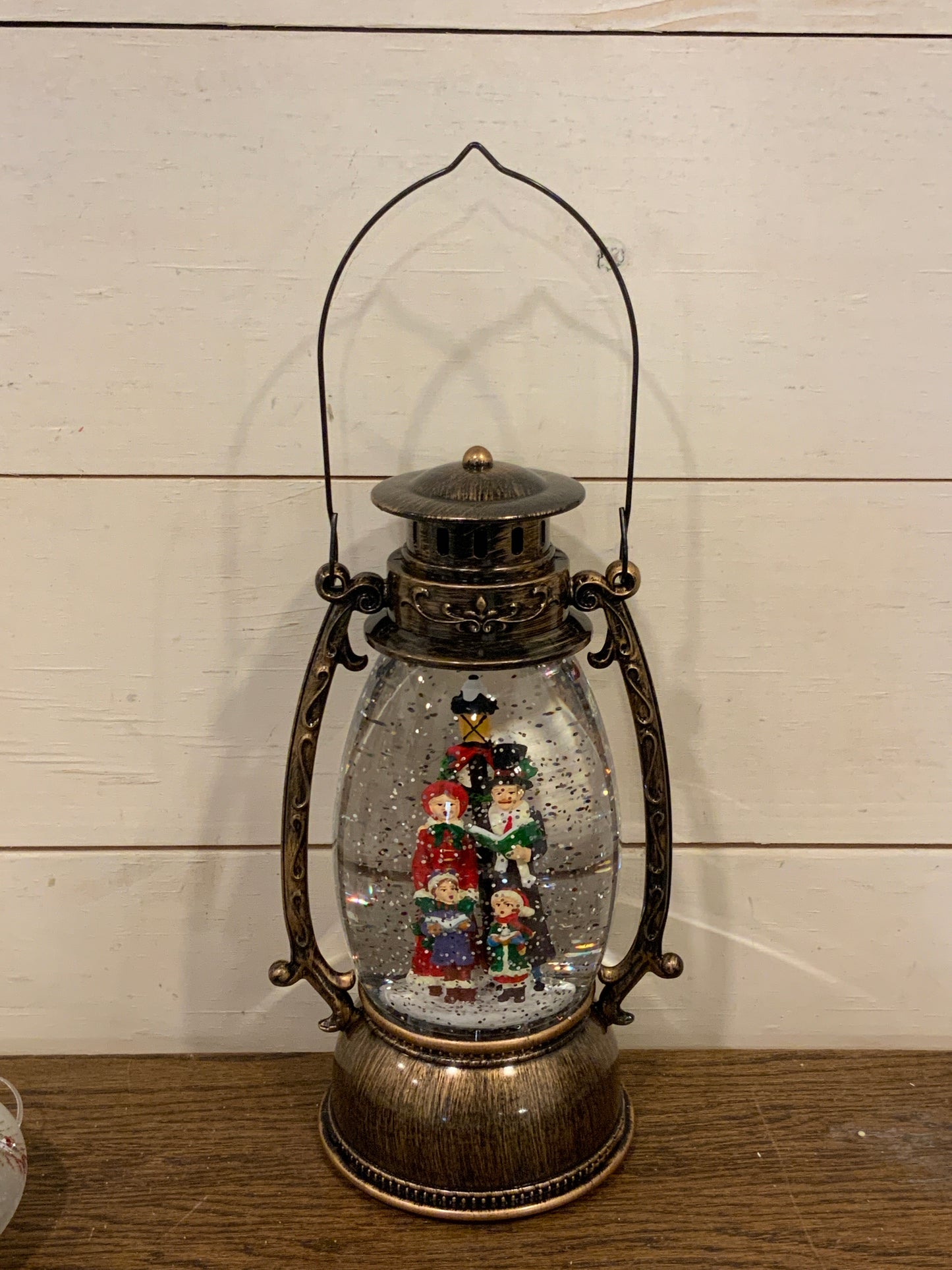 9.5” lighted holiday scene spinning water globe lantern